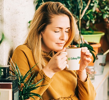 Woman enjoying calming blends diverticulitis tea